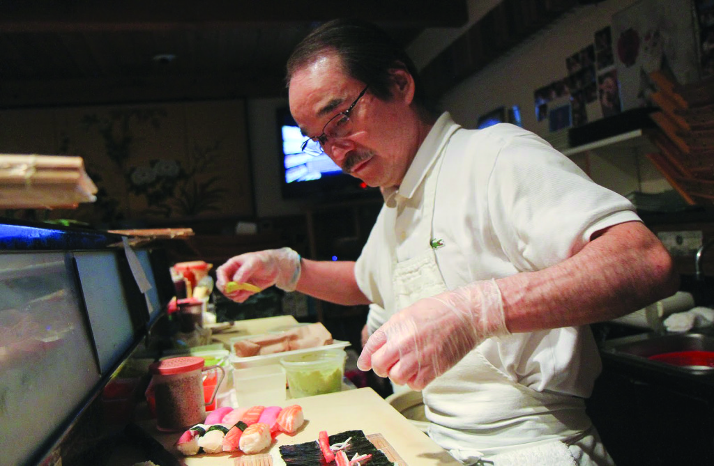 Chef Shigehisa Imai preparing food.