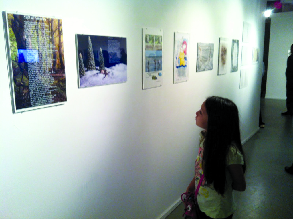 A young student looking at the artwork.