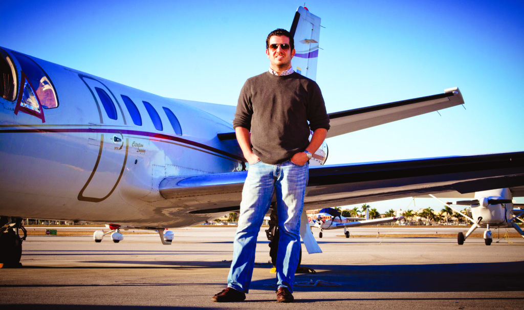 Aviation student Joaquin Mantovani posing in front of a jet.