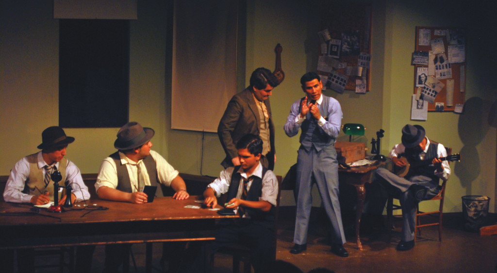 Student actors on stage performing in the play The Front Page.