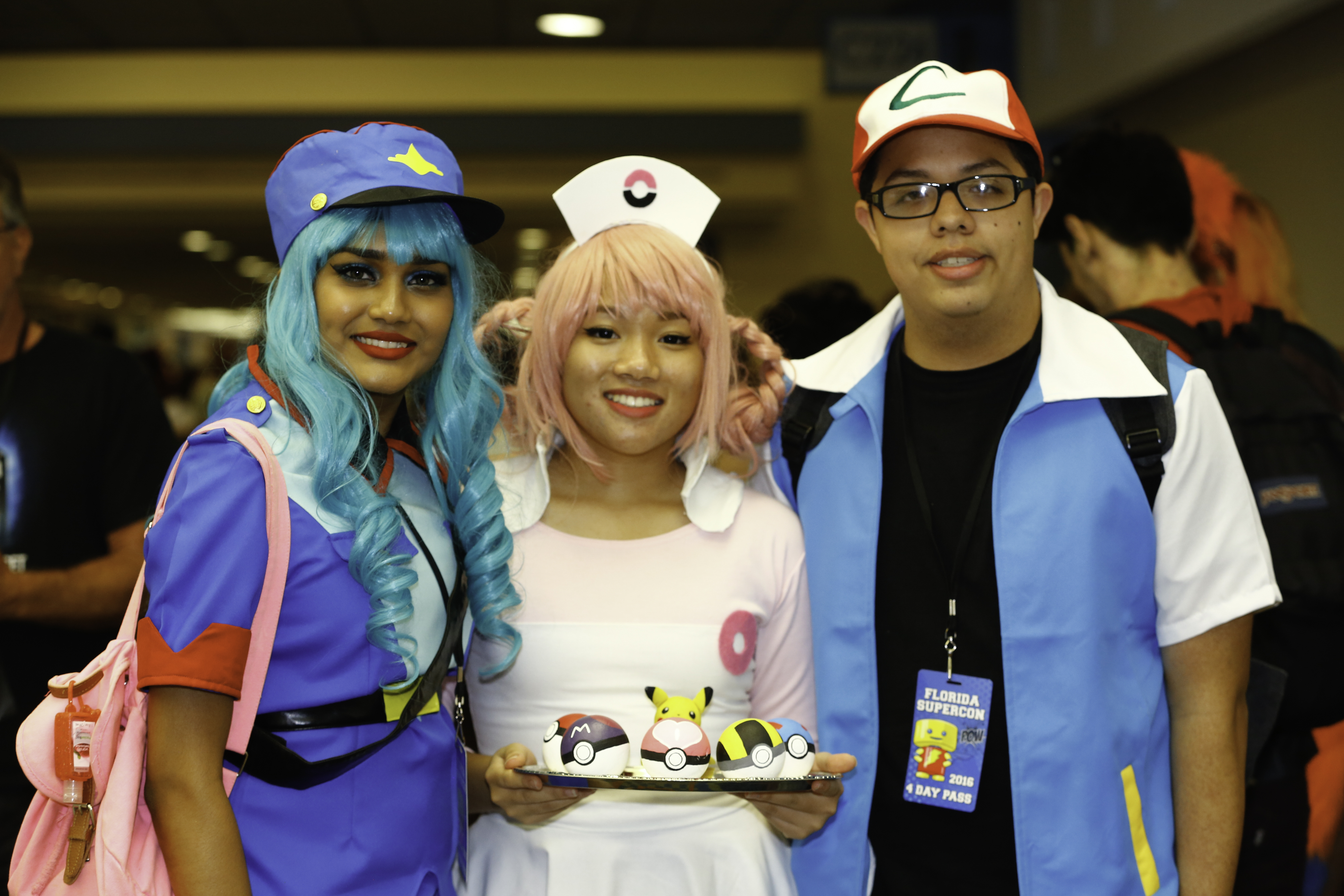 Cosplayers dressed as characters from Pokemon.