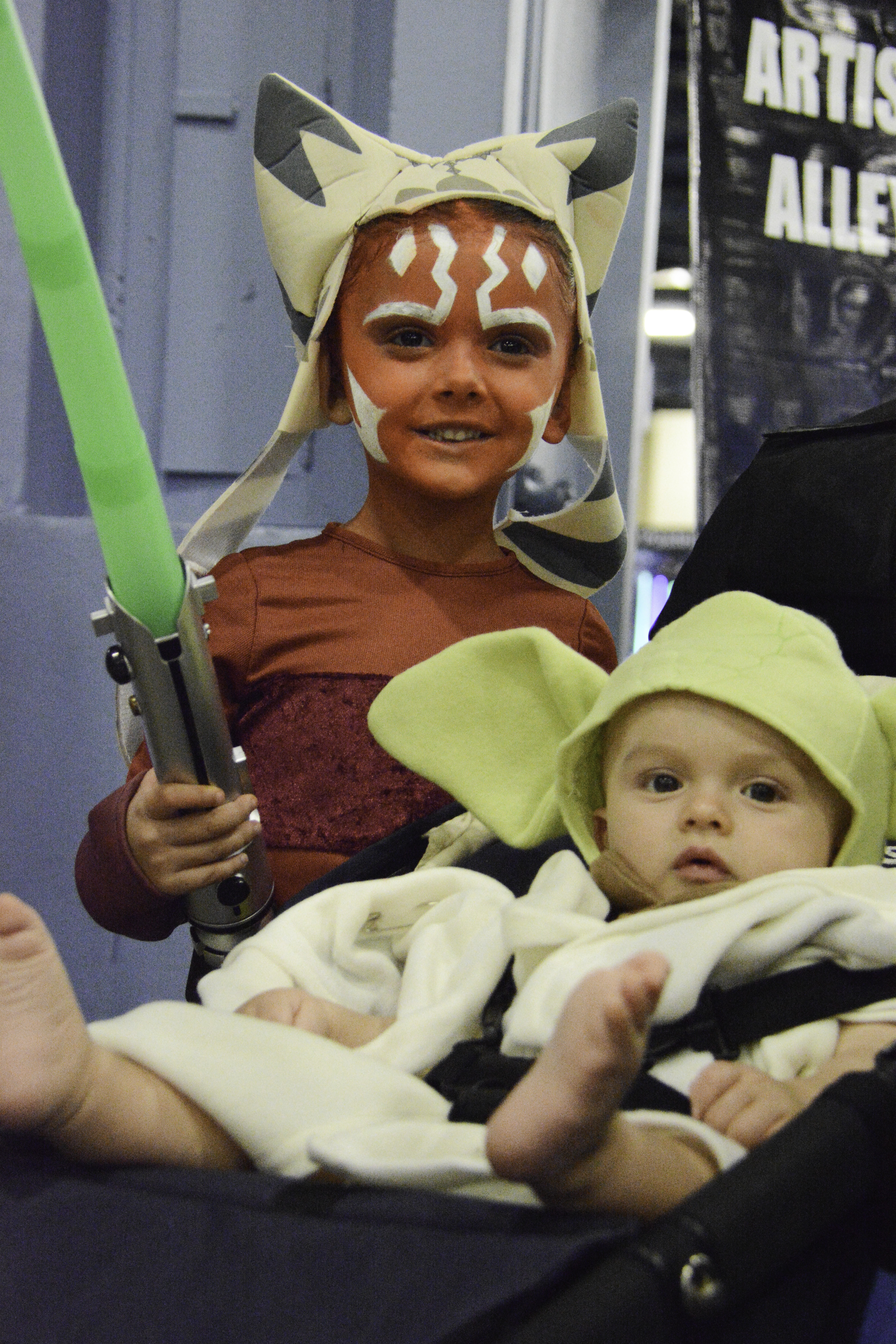 Two children dressed as Ahsoka Tano and Yoda from Start Wars.