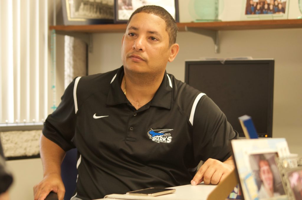 Photo of Coach Benoit in his office.