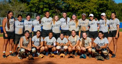 The Lady Sharks softball team posing for a picture.