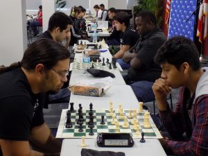 Students playing chess at the chess tournament.