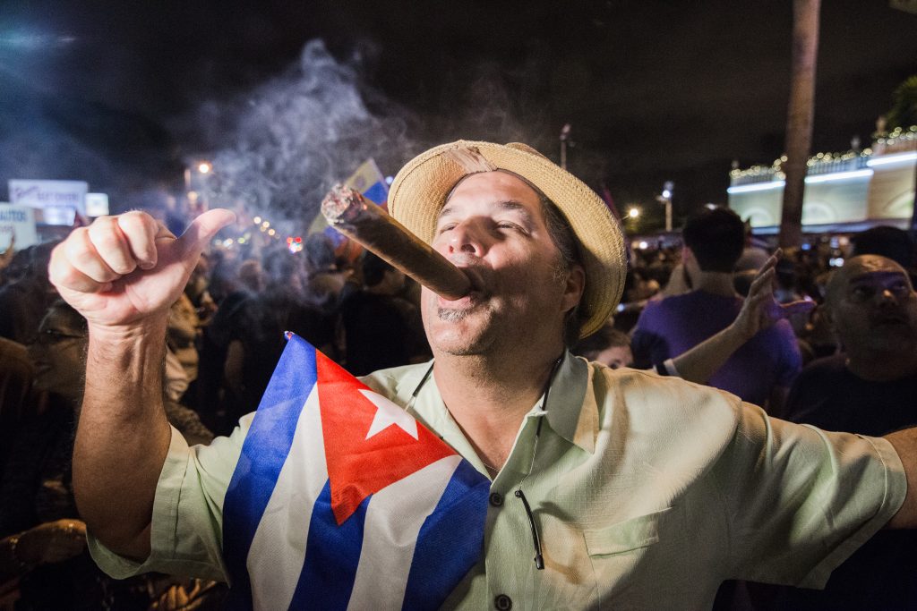 A Miami Cuban smoking a cigar celebrating Fidel Castro's death.