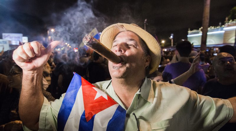 A Miami Cuban smoking a cigar celebrating Fidel Castro's death.