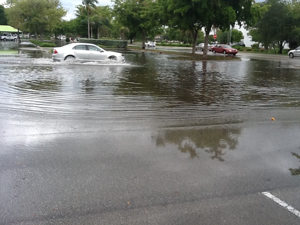 A car driving through a flooded area.