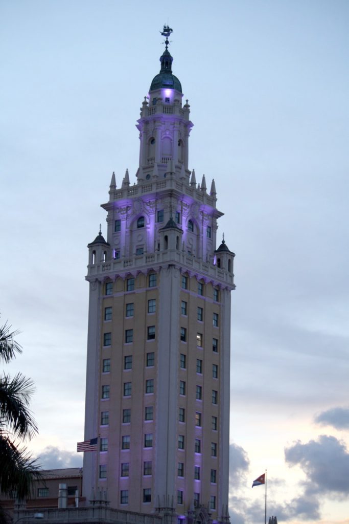 The Freedom Tower in downtown Miami lighted up purple.