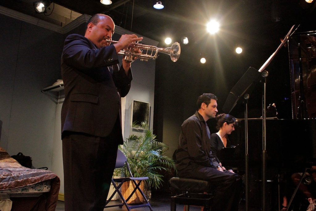 Faculty performing on stage.