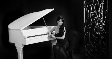 Ana Rodriguez with her piano in a glamour shot.