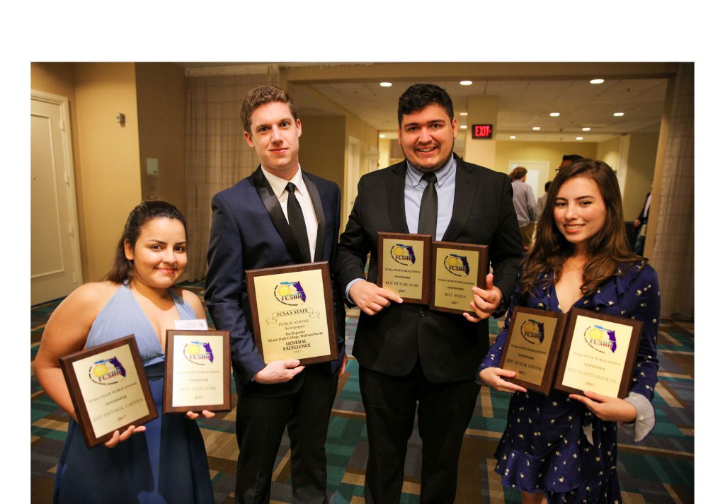 Staff members of The Reporter with their awards.