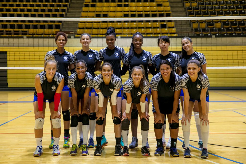 MDC's Lady Sharks volleyball team posing for the camera.