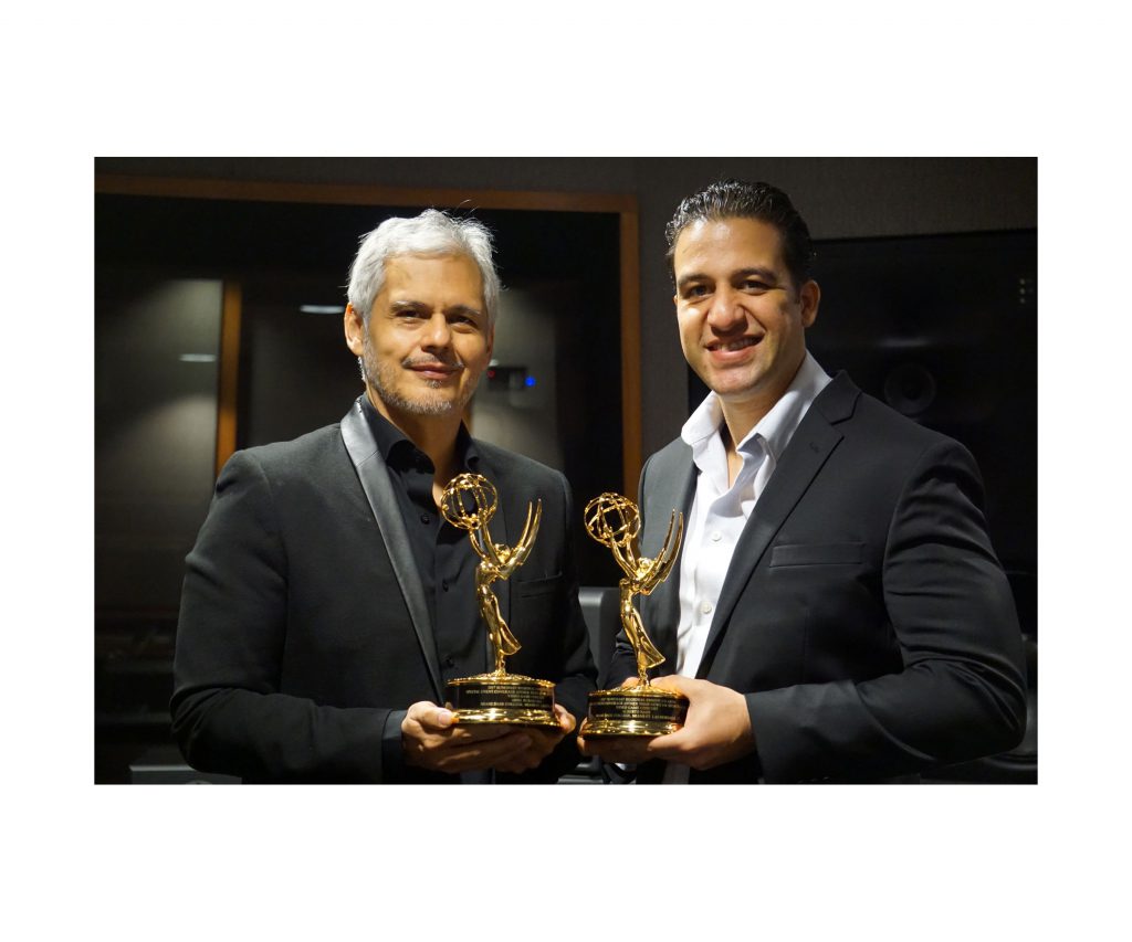 Ariel Rubalcava and Alberto Bade with their awards for MDC-TV.