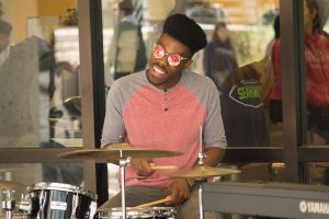 Student playing the drums.