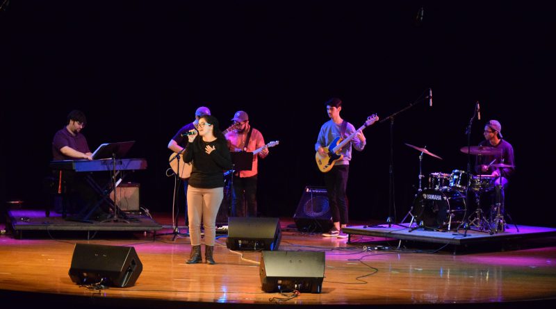 Students performing on stage.