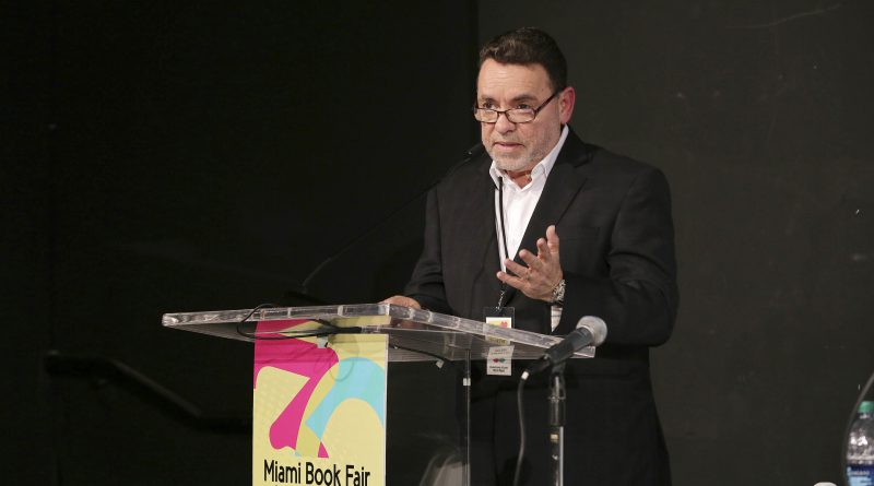 Photo of Alejandro Rios at a podium.