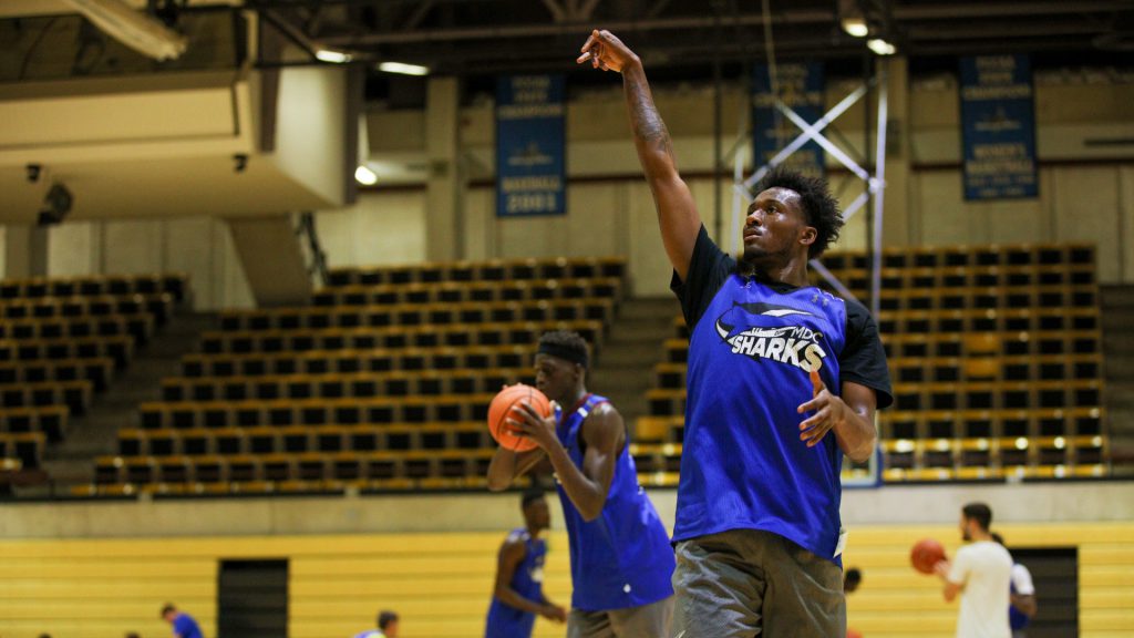 DJ Russell shooting for Sharks basketball.