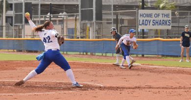 The Lady Sharks softball team during a game.