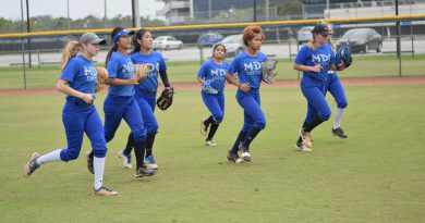 The Lady Sharks softball team at practice.