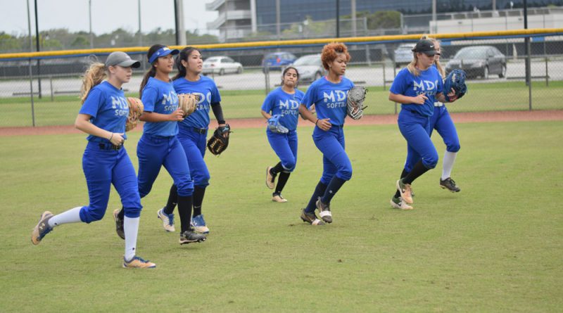 The Lady Sharks softball team at practice.