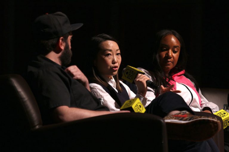 Three directors up on stage for a discussion Miami Film Festival.