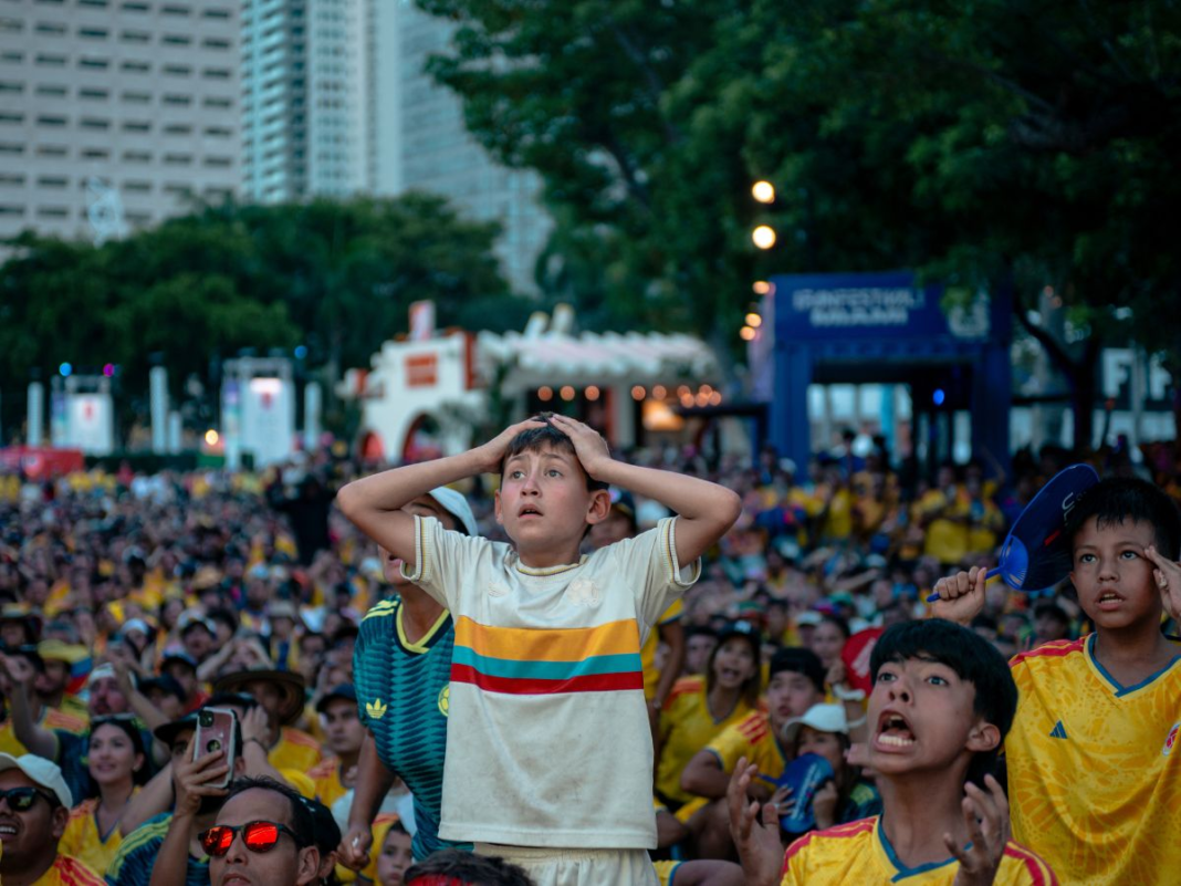 Youth Of A Nation: A young Colombia soccer fan reacts in disbelief while watching the end of the FIFA World Cup Group K match against Portugal at the FIFA Fan Fest in Miami June 27. The game ended in a 0-0 tie. LUCAS DUARTE/THE REPORTER.