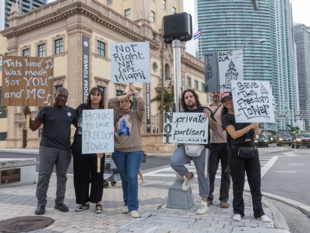 Photo of a protest in front of the Freedom Tower