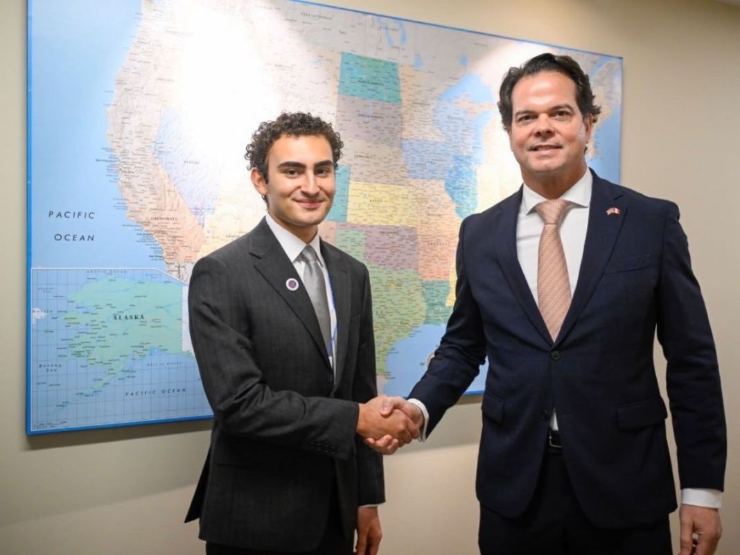 Picture of Wolfson Campus Honors College student Paolo Bello and United States ambassador to Peru Bernie Navarro.